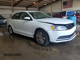 2015 Volkswagen Jetta SE with VIN 3VWD17AJ5FM256703, listed as a Copart auction lot 62699375 with 130,247 mi miles and Salvage title. Bid and sale history available at DreamBid. Image 4.