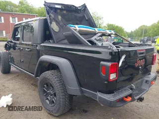 2021 Jeep Gladiator Mojave z VIN 1C6JJTEG9ML605638, wystawiony jako IAAI lot #40302253 z przebiegiem 32 019 mil mil oraz . Historia ofert i sprzedaży dostępna na DreamBid. Obrazek 3.