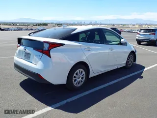 2021 Toyota Prius L Eco with VIN JTDKAMFU9M3133528, listed as a IAAI auction lot 41950856 with 138,787 mi miles. Bid and sale history available at carsss.com. Image 4.