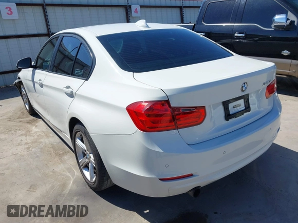 2015 BMW 3 Series 320i with VIN WBA3B1C53FK138341, listed as a IAAI auction lot 41757490 with 125,280 mi miles. Bid and sale history available at carsss.com. Image 3.