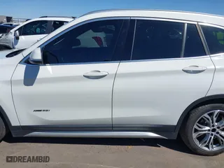 2017 BMW X1 xDrive28i with VIN WBXHT3C30H5F68187, listed as a IAAI auction lot 41830892 with 101,313 mi miles. Bid and sale history available at carsss.com. Image 14.