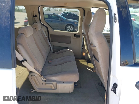 2006 Ford Freestar SE z VIN 2FMZA51686BA57540, wystawiony jako IAAI lot #41883258 z przebiegiem 38 590 mil mil oraz . Historia ofert i sprzedaży dostępna na DreamBid. Obrazek 8.