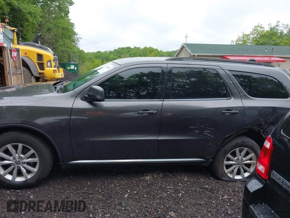 2015 Dodge Durango SXT with VIN 1C4RDJAG6FC177561, listed as a IAAI auction lot 42314437 with 104,898 mi miles and . Bid and sale history available at DreamBid. Image 14.