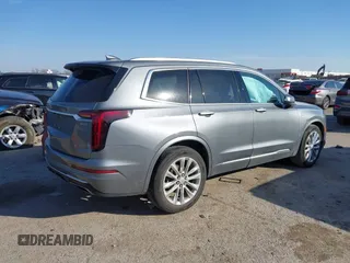 2020 Cadillac XT6 FWD Premium Luxury z VIN 1GYKPCRS8LZ129799, wystawiony jako IAAI lot #41602536 z przebiegiem 96 865 mil mil oraz . Historia ofert i sprzedaży dostępna na DreamBid. Obrazek 4.