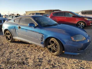 2005 Hyundai Tiburon GT z VIN KMHHN65F35U186438, wystawiony jako Copart lot #41879955 z przebiegiem 152 574 mil mil oraz Szkoda całkowita • Salvage title. Historia ofert i sprzedaży dostępna na DreamBid. Obrazek 4.