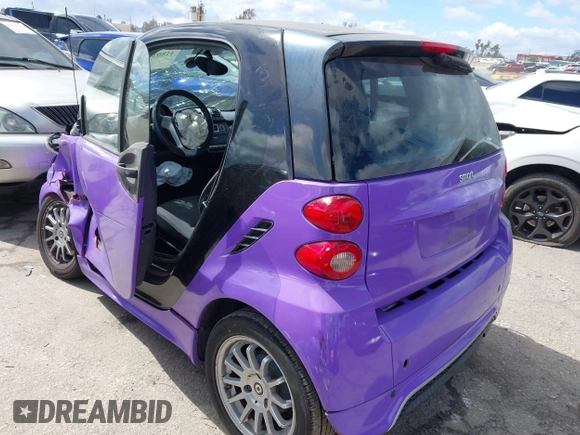 2013 Smart fortwo Pure with VIN WMEEJ3BA0DK686417, listed as a IAAI auction lot 41803956 with 83,850 mi miles. Bid and sale history available at carsss.com. Image 3.