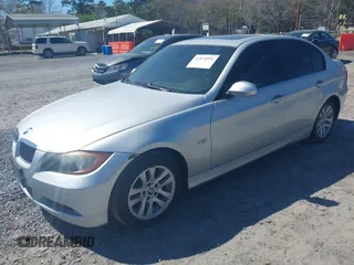 2007 BMW 3 Series 328i with VIN WBAVA33597PV64448, listed as a IAAI auction lot 41874952 with 203,284 mi miles. Bid and sale history available at carsss.com. Image 2.