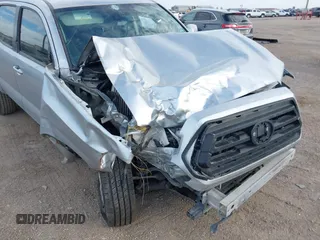 2022 Toyota Tacoma SR with VIN 3TYAX5GN8NT060017, listed as a IAAI auction lot 41504710 with 55,317 mi miles and . Bid and sale history available at DreamBid. Image 6.