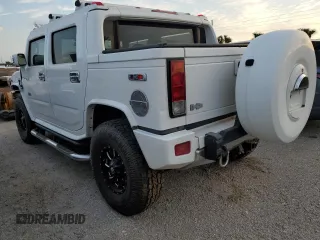 2006 Hummer H2 with VIN 5GRGN22U56H105928, listed as a Copart auction lot 76692904 with 0 mi miles and Salvage Title. Bid and sale history available at carsss.com. Image 2.