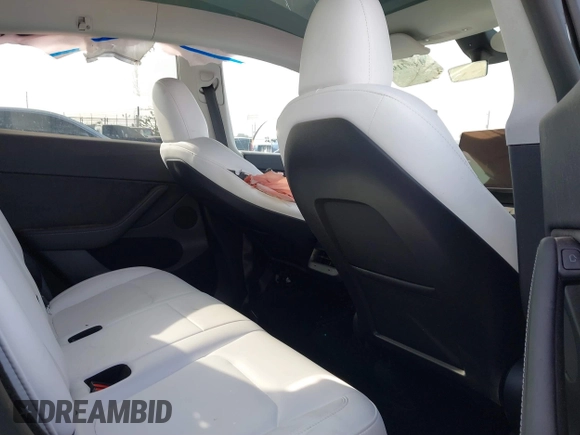 2023 Tesla Model Y Long Range with VIN 7SAYGDEE3PF900030, listed as a IAAI auction lot 41147192 with 13,903 mi miles and . Bid and sale history available at DreamBid. Image 8.
