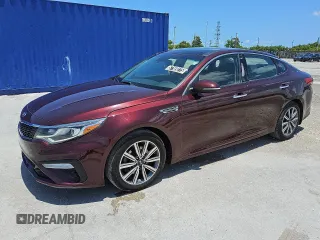 2019 Kia Optima LX z VIN 5XXGT4L34KG300242, wystawiony jako Copart lot #57169275 z przebiegiem 44 292 mil mil oraz Czysty tytuł • Clean title. Historia ofert i sprzedaży dostępna na DreamBid. Obrazek 1.