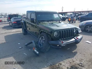 2023 Jeep Gladiator Rubicon z VIN 1C6JJTBGXPL586154, wystawiony jako IAAI lot #41370352 z przebiegiem 11 207 mil mil oraz . Historia ofert i sprzedaży dostępna na DreamBid. Obrazek 1.