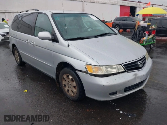 2004 Honda Odyssey EX-L with VIN 5FNRL18934B016420, listed as a IAAI auction lot 41473237 with 188,659 mi miles and . Bid and sale history available at DreamBid. Image 6.