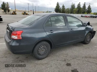 2009 Toyota Yaris with VIN JTDBT903291324461, listed as a Copart auction lot 54769875 with 141,777 mi miles and Salvage Title. Bid and sale history available at DreamBid. Image 3.