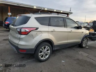 2018 Ford Escape SE z VIN 1FMCU9GD7JUA34635, wystawiony jako Copart lot #48379395 z przebiegiem 123 832 mil mil oraz Szkoda całkowita • Salvage title. Historia ofert i sprzedaży dostępna na DreamBid. Obrazek 3.