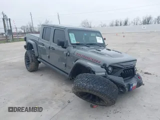 2022 Jeep Gladiator Rubicon z VIN 1C6JJTBG1NL144375, wystawiony jako IAAI lot #41588807 z przebiegiem 47 373 mil mil oraz . Historia ofert i sprzedaży dostępna na DreamBid. Obrazek 1.
