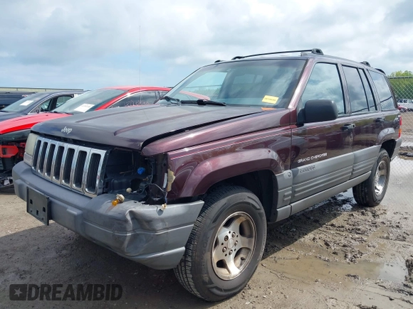 1997 Jeep Grand Cherokee Laredo with VIN 1J4GZ58S4VC702040, listed as a IAAI auction lot 42165536 with 121,803 mi miles and . Bid and sale history available at DreamBid. Image 2.