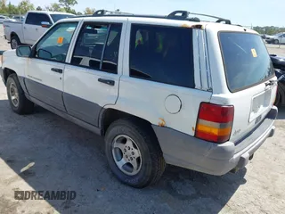 1996 Jeep Grand Cherokee Laredo with VIN 1J4EX58S6TC126610, listed as a IAAI auction lot 41801779 with 1 mi miles. Bid and sale history available at carsss.com. Image 3.