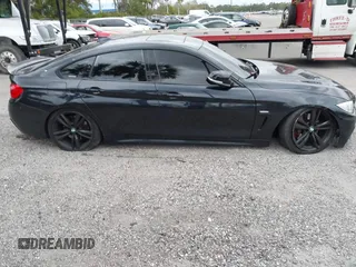 2015 BMW 4 Series 435i with VIN WBA4B1C5XFD955119, listed as a IAAI auction lot 41349918 with 181,937 mi miles and . Bid and sale history available at carsss.com. Image 14.