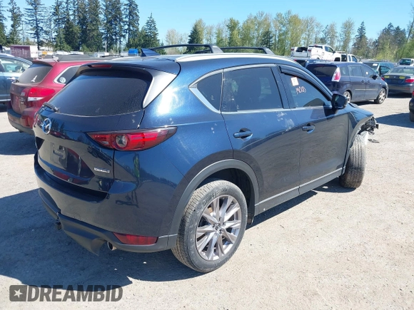 2020 Mazda CX-5 Grand Touring with VIN JM3KFBDM7L0724005, listed as a IAAI auction lot 42034658 with 90,631 mi miles. Bid and sale history available at carsss.com. Image 4.
