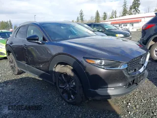 2021 Mazda CX-30 Premium with VIN 3MVDMBDY2MM239231, listed as a IAAI auction lot 41655159 with 22,679 mi miles and . Bid and sale history available at carsss.com. Image 1.