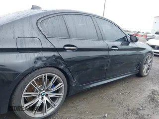 2018 BMW 5 Series M550i xDrive with VIN WBAJB9C59JB049114, listed as a IAAI auction lot 41543633 with 87,942 mi miles and . Bid and sale history available at carsss.com. Image 18.