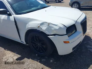 2009 Chrysler 300 Touring with VIN 2C3KA53V89H634048, listed as a IAAI auction lot 41974629 with Not Provided miles and . Bid and sale history available at DreamBid. Image 6.