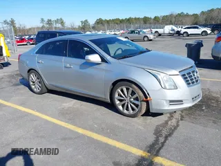 2013 Cadillac XTS Premium with VIN 2G61S5S35D9209252, listed as a IAAI auction lot 41275066 with 132,311 mi miles. Bid and sale history available at carsss.com. Image 1.