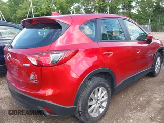 2015 Mazda CX-5 Sport with VIN JM3KE2BE8F0451014, listed as a IAAI auction lot 42536333 with 131,059 mi miles and . Bid and sale history available at DreamBid. Image 4.