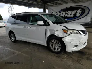 2012 Toyota Sienna XLE AAS with VIN 5TDYK3DC7CS275496, listed as a Copart auction lot 62612815 with 130,027 mi miles and Salvage title. Bid and sale history available at DreamBid. Image 4.