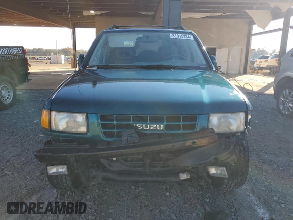 1999 Isuzu Rodeo S с VIN 4S2CK58W6X4352441, выставлен на аукционе Copart как лот 81915384 с пробегом 338 513 миль миль и На запчасти • Non repairable. История ставок и продаж доступна на DreamBid. Изображение 5.