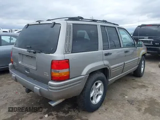 1998 Jeep Grand Cherokee Limited with VIN 1J4GZ88Z7WC223496, listed as a IAAI auction lot 41484317 with 244,567 mi miles. Bid and sale history available at carsss.com. Image 4.