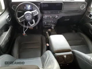 2024 Jeep Wrangler Sahara with VIN 1C4PJXEG0RW369476, listed as a Copart auction lot 49054345 with 816 mi miles and Salvage title. Bid and sale history available at DreamBid. Image 8.