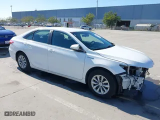 2015 Toyota Camry Hybrid LE with VIN 4T1BD1FK9FU155428, listed as a IAAI auction lot 41666063 with 154,608 mi miles. Bid and sale history available at carsss.com. Image 1.