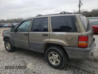1996 Jeep Grand Cherokee Laredo with VIN 1J4FX58S5TC248122, listed as a Copart auction lot 45843935 with 295,521 mi miles and Salvage Title. Bid and sale history available at carsss.com. Image 2.