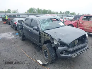 2022 Toyota Tacoma SR with VIN 3TMCZ5AN1NM476353, listed as a IAAI auction lot 41938107 with 51,782 mi miles and . Bid and sale history available at DreamBid. Image 6.