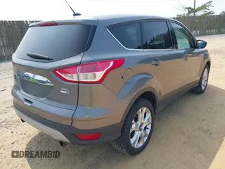 2013 Ford Escape SEL with VIN 1FMCU9H99DUC25469, listed as a IAAI auction lot 42402148 with 99,830 mi miles and . Bid and sale history available at DreamBid. Image 4.
