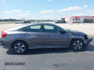 2020 Honda Civic LX with VIN 19XFC2F68LE007735, listed as a IAAI auction lot 42215294 with 3,849 mi miles and . Bid and sale history available at DreamBid. Image 13.