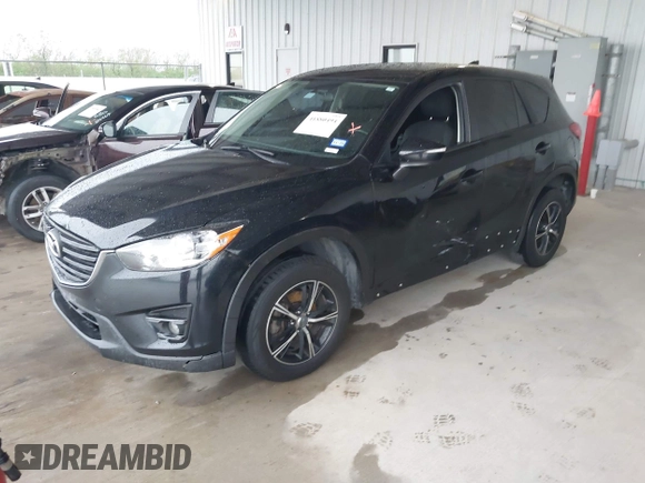 2016 Mazda CX-5 Touring with VIN JM3KE2CY2G0808424, listed as a IAAI auction lot 41880494 with 149,005 mi miles. Bid and sale history available at carsss.com. Image 18.