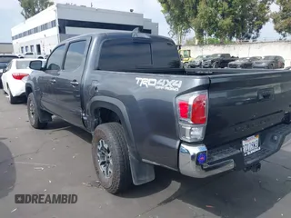 2023 Toyota Tacoma SR with VIN 3TMCZ5AN0PM635933, listed as a IAAI auction lot 42543126 with 32,960 mi miles and . Bid and sale history available at DreamBid. Image 3.