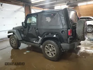 2014 Jeep Wrangler Sport with VIN 1C4AJWAG5EL307945, listed as a Copart auction lot 60152035 with 119,508 mi miles and Salvage title. Bid and sale history available at DreamBid. Image 2.