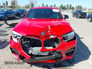 2021 BMW X4 M with VIN 5YMUJ0C08M9H70033, listed as a IAAI auction lot 41671276 with 18,151 mi miles. Bid and sale history available at carsss.com. Image 13.