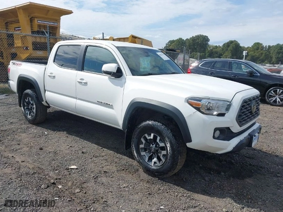 2021 Toyota Tacoma 4WD SR with VIN 3TMCZ5AN8MM424104, listed as a IAAI auction lot 40581284 with 74,706 mi miles. Bid and sale history available at carsss.com. Image 1.