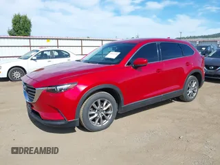 2016 Mazda CX-9 Touring z VIN JM3TCACY9G0122174, wystawiony jako IAAI lot #42613740 z przebiegiem 148 646 mil mil oraz . Historia ofert i sprzedaży dostępna na DreamBid. Obrazek 17.