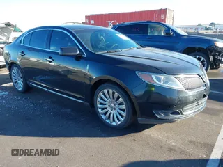 2013 Lincoln MKS z VIN 1LNHL9EK0DG610434, wystawiony jako IAAI lot #41304269 z przebiegiem 143 192 mil mil oraz . Historia ofert i sprzedaży dostępna na DreamBid. Obrazek 1.