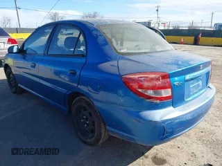 2003 Kia Rio with VIN KNADC125936239472, listed as a IAAI auction lot 41729536 with 156,421 mi miles. Bid and sale history available at carsss.com. Image 3.