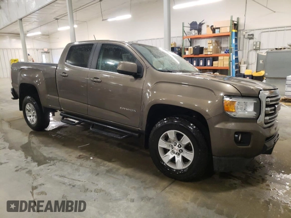2015 GMC Canyon 4WD SLE z VIN 1GTG6BE3XF1242163, wystawiony jako Copart lot #57132035 z przebiegiem 110 241 mil mil oraz Szkoda całkowita • Salvage title. Historia ofert i sprzedaży dostępna na DreamBid. Obrazek 4.