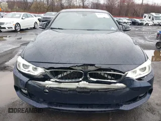 2016 BMW 4 Series 428i xDrive with VIN WBA4C9C59GG137067, listed as a IAAI auction lot 41913733 with 104,378 mi miles and . Bid and sale history available at carsss.com. Image 6.