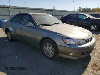2000 Lexus ES 300 with VIN JT8BF28GXY5091263, listed as a Copart auction lot 61767595 with 250,041 mi miles and Salvage title. Bid and sale history available at DreamBid. Image 4.