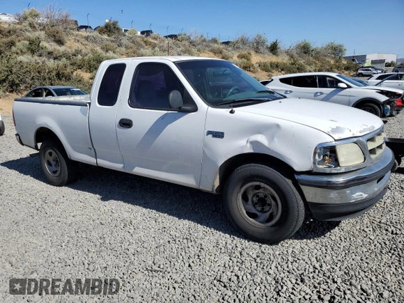 1998 Ford F-150 with VIN 1FTZX1720WKA20813, listed as a Copart auction lot 63852215 with 215,729 mi miles and Salvage title. Bid and sale history available at DreamBid. Image 4.